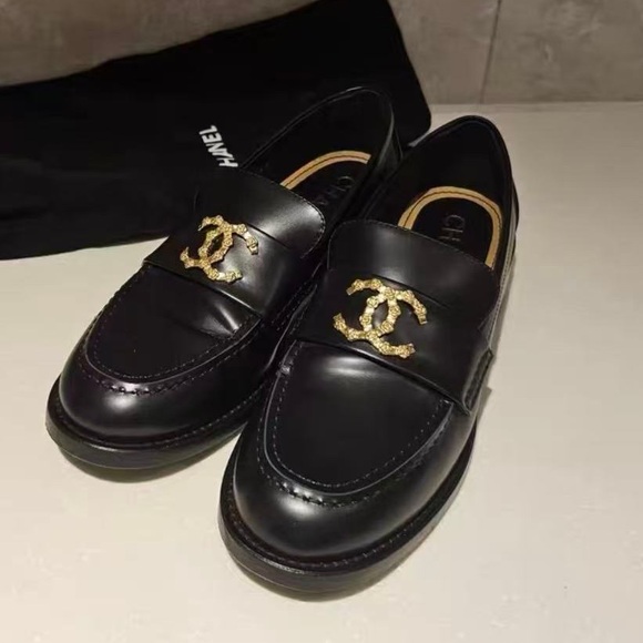 CHANEL Shoes - CHANEL Elegant Black Loafers with Gold Logo